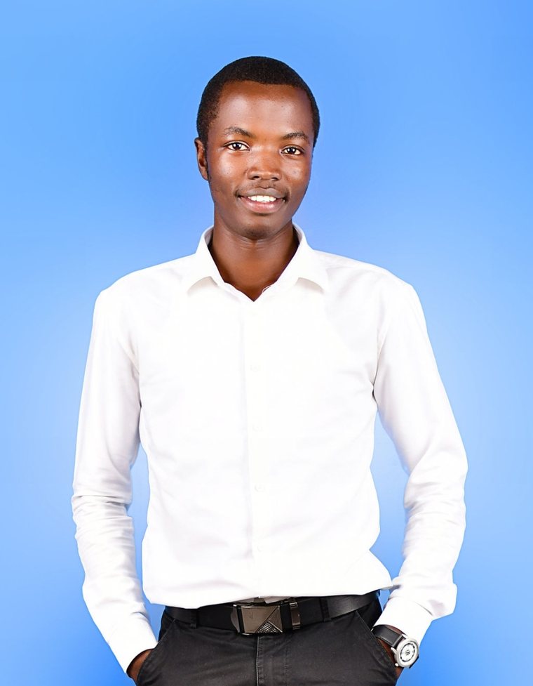 Alex Were, software developer, smiling in a white shirt